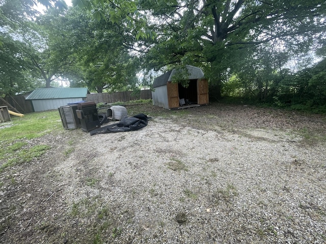 421 N Phelps St, Mansfield, MO 65704 - view of yard with a shed, fence, and an outbuilding