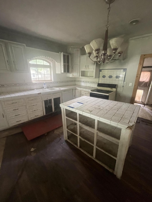 421 N Phelps St, Mansfield, MO 65704 - kitchen featuring electric range, tile countertops, a chandelier, and a sink