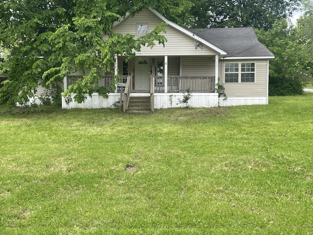 421 N Phelps St, Mansfield, MO 65704 - view of front facade with a porch and a front lawn