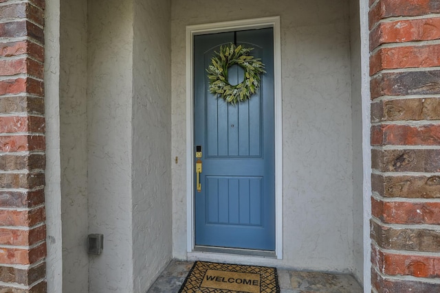 143 Woodfield Dr, Highlandville, MO 65669 - doorway to property with brick siding and stucco siding