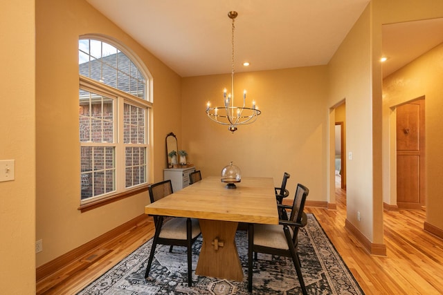 143 Woodfield Dr, Highlandville, MO 65669 - dining area featuring a chandelier, light wood finished floors, and baseboards