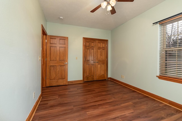 143 Woodfield Dr, Highlandville, MO 65669 - unfurnished bedroom with wood finished floors, baseboards, ceiling fan, and a closet