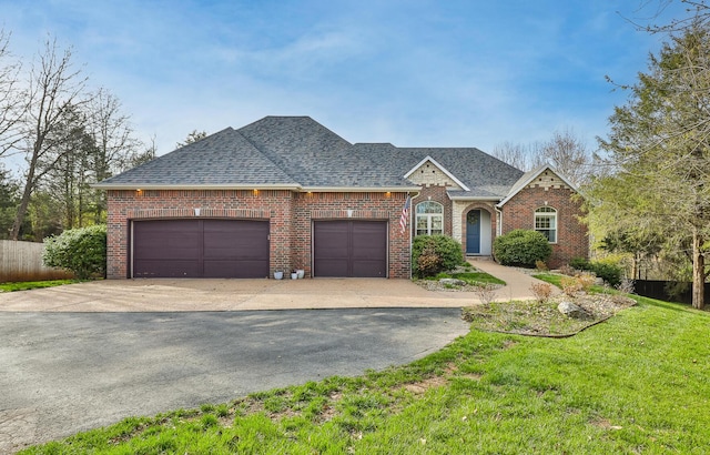 143 Woodfield Dr, Highlandville, MO 65669 - view of front of home featuring brick siding, concrete driveway, a garage, a shingled roof, and a front yard