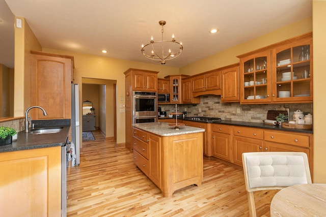 143 Woodfield Dr, Highlandville, MO 65669 - kitchen featuring a sink, appliances with stainless steel finishes, light wood finished floors, backsplash, and recessed lighting