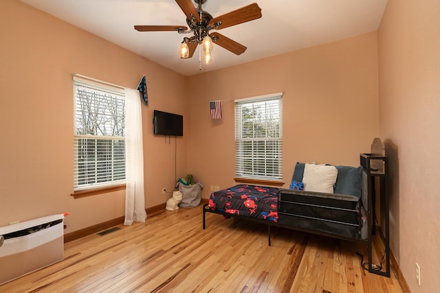 143 Woodfield Dr, Highlandville, MO 65669 - living area with hardwood / wood-style floors, baseboards, and a ceiling fan