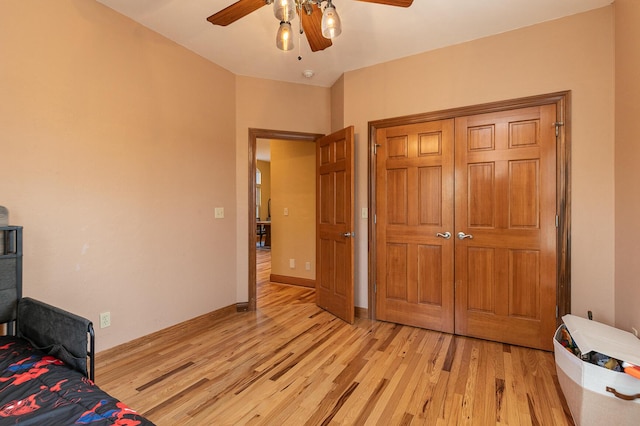 143 Woodfield Dr, Highlandville, MO 65669 - bedroom with light wood-type flooring, a ceiling fan, and baseboards