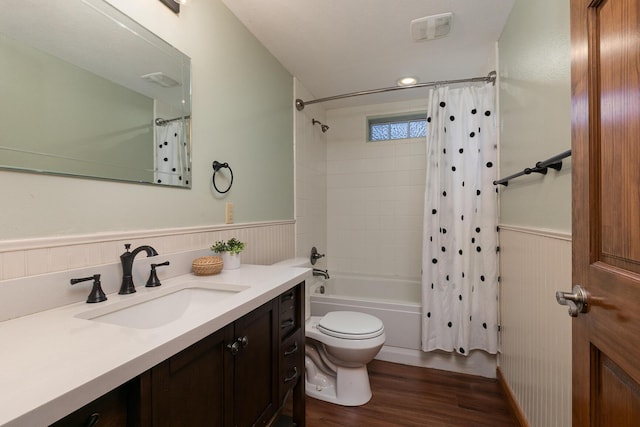 143 Woodfield Dr, Highlandville, MO 65669 - full bathroom featuring a wainscoted wall, wood finished floors, vanity, shower / bathtub combination with curtain, and toilet