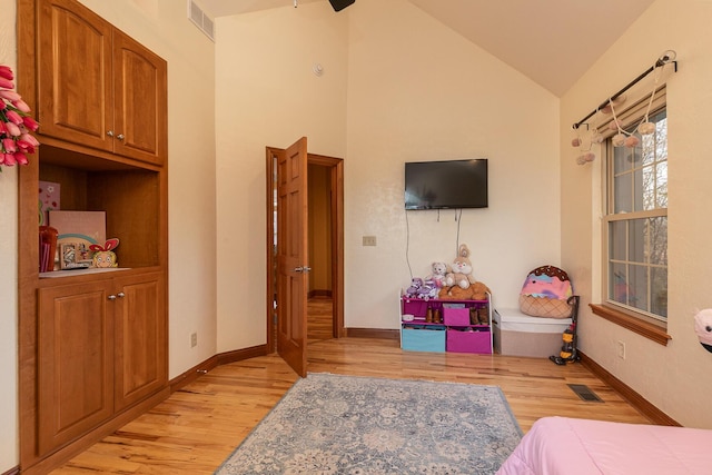143 Woodfield Dr, Highlandville, MO 65669 - bedroom with light wood-style floors, lofted ceiling, and baseboards