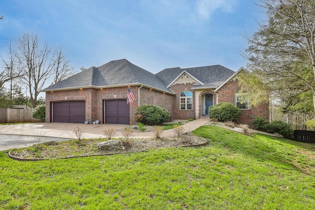 143 Woodfield Dr, Highlandville, MO 65669 - view of front of house with brick siding, an attached garage, concrete driveway, and roof with shingles
