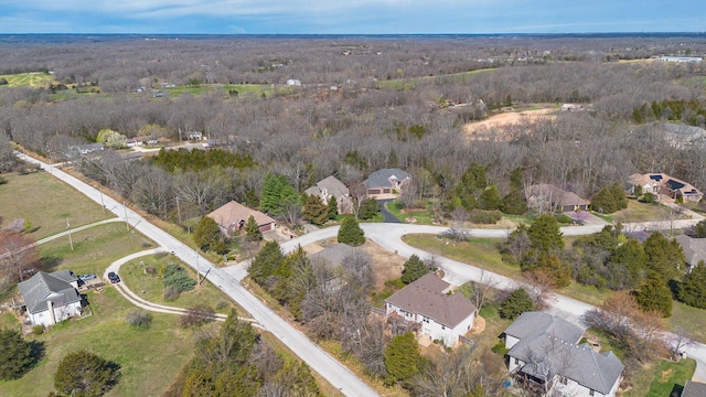 143 Woodfield Dr, Highlandville, MO 65669 - aerial view of property's location with nearby suburban area and a forest