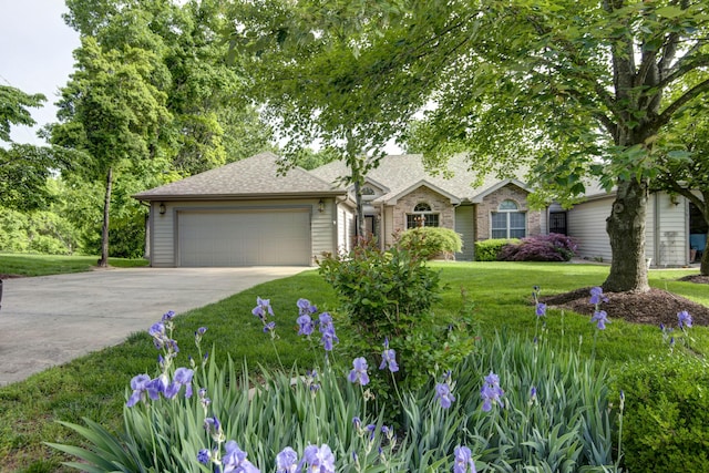 1783 Cedar Ridge Way, Branson West, MO 65737 - view of front of home with driveway, an attached garage, a front lawn, and roof with shingles