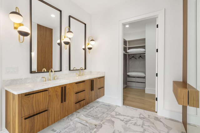 273 Secret Ln, Branson West, MO 65737 - full bathroom with marble look tiles, a walk in closet, recessed lighting, double vanity, and baseboards