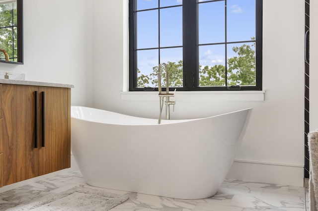273 Secret Ln, Branson West, MO 65737 - full bathroom with marble finish floors, vanity, and a freestanding tub