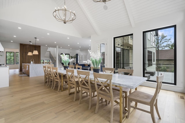273 Secret Ln, Branson West, MO 65737 - dining space featuring light wood-type flooring, high vaulted ceiling, beamed ceiling, a chandelier, and recessed lighting