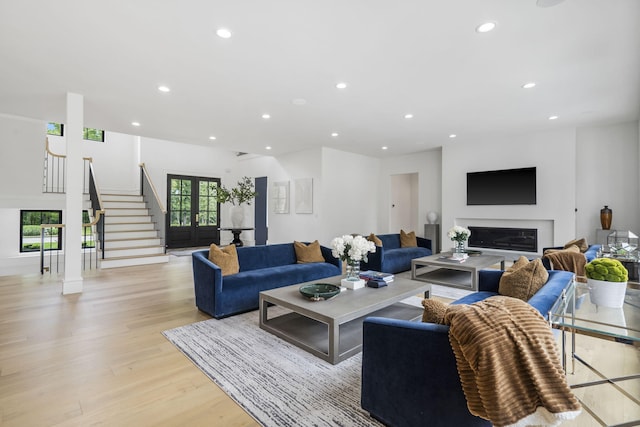273 Secret Ln, Branson West, MO 65737 - living area featuring light wood-style floors, recessed lighting, stairs, and a glass covered fireplace