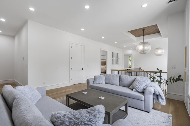 273 Secret Ln, Branson West, MO 65737 - living area with wood finished floors, baseboards, recessed lighting, and a tray ceiling
