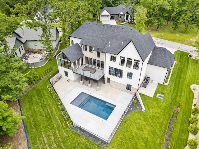 273 Secret Ln, Branson West, MO 65737 - rear view of property with a patio area, an outdoor pool, a shingled roof, and a yard