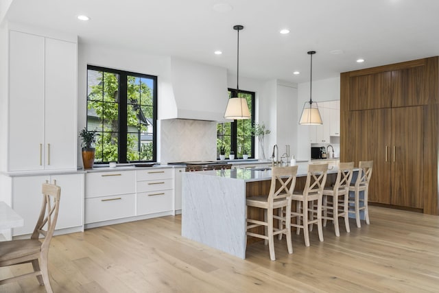 273 Secret Ln, Branson West, MO 65737 - kitchen featuring modern cabinets, a sink, recessed lighting, an island with sink, and light wood-type flooring