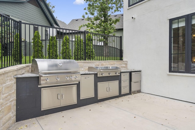 273 Secret Ln, Branson West, MO 65737 - view of patio with a grill, exterior kitchen, and fence