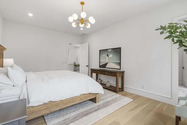 273 Secret Ln, Branson West, MO 65737 - bedroom with light wood-type flooring, a chandelier, recessed lighting, and baseboards