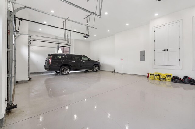 273 Secret Ln, Branson West, MO 65737 - garage featuring a garage door opener, electric panel, and recessed lighting