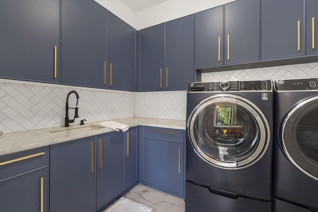 273 Secret Ln, Branson West, MO 65737 - laundry room featuring cabinet space, washing machine and dryer, and light marble finish flooring
