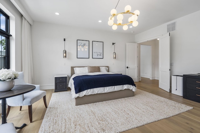 273 Secret Ln, Branson West, MO 65737 - bedroom featuring wood finished floors, a chandelier, recessed lighting, and baseboards