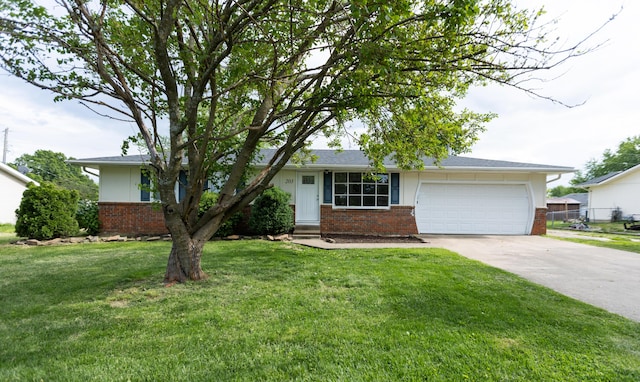 view of front facade featuring brick siding, an attached garage, driveway, a front yard, and entry steps