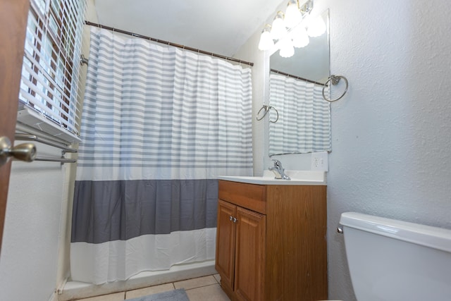 full bathroom with tile patterned floors, vanity, toilet, and a shower with shower curtain