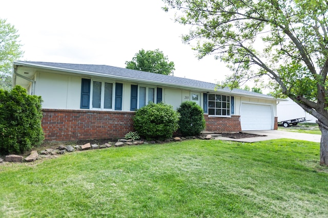 ranch-style home with brick siding, a garage, concrete driveway, and a front yard