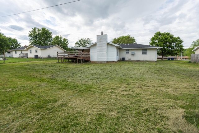 view of yard featuring a wooden deck and cooling unit