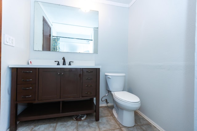 full bathroom featuring toilet, baseboards, vanity, and tile patterned flooring