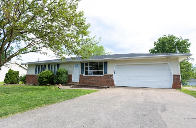 ranch-style house featuring brick siding, driveway, an attached garage, and a front lawn