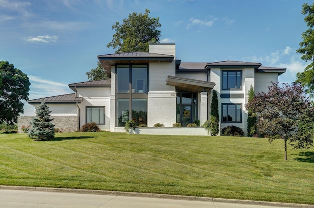 3900 E Dunrobin Dr, Springfield, MO 65809 - modern home with a standing seam roof, a metal roof, and a front yard