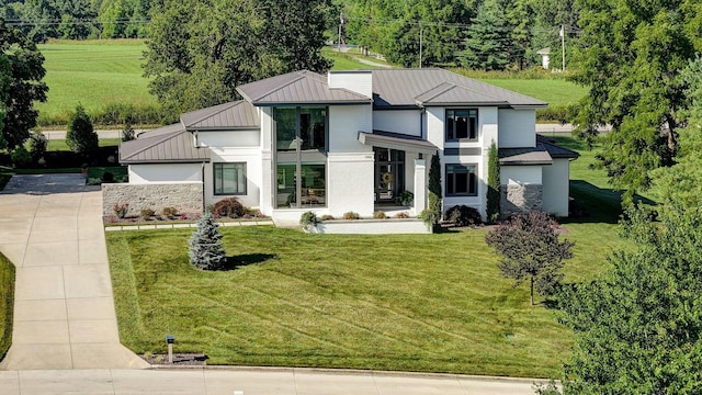 3900 E Dunrobin Dr, Springfield, MO 65809 - contemporary home with a front lawn, a metal roof, and a standing seam roof