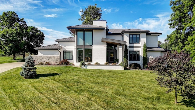 3900 E Dunrobin Dr, Springfield, MO 65809 - modern home with a standing seam roof, a metal roof, and a front lawn