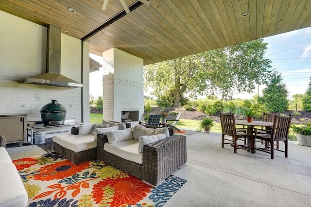 3900 E Dunrobin Dr, Springfield, MO 65809 - view of patio / terrace featuring outdoor dining space, an outdoor living space with a fireplace, and area for grilling