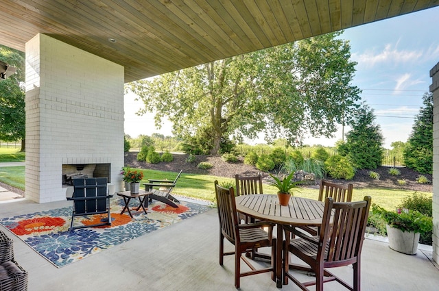 3900 E Dunrobin Dr, Springfield, MO 65809 - view of patio featuring an outdoor brick fireplace and outdoor dining space