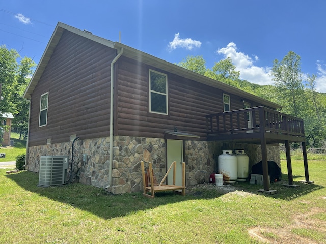 941 Peace In The Valley Rd, Blue Eye, MO 65611 - view of side of property featuring central air condition unit, a yard, a deck, and log veneer siding