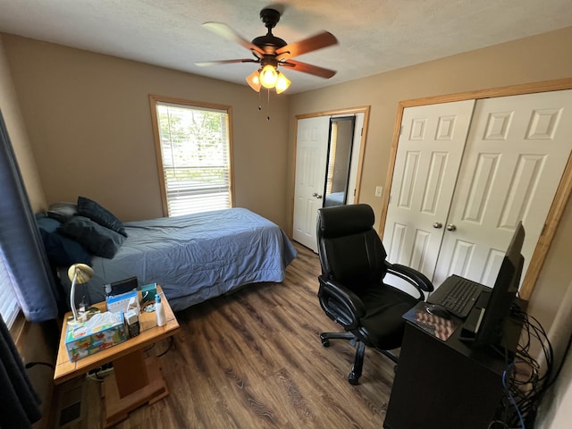 941 Peace In The Valley Rd, Blue Eye, MO 65611 - bedroom with wood finished floors, a desk, ceiling fan, and multiple closets