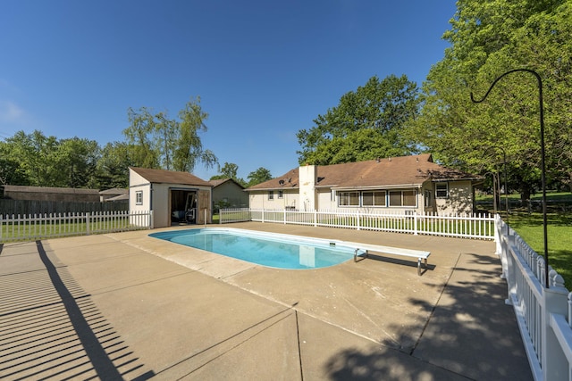 4852 S Charleston Ave, Springfield, MO 65804 - view of swimming pool with a patio, a diving board, an outbuilding, fence, and a shed