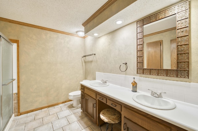 4852 S Charleston Ave, Springfield, MO 65804 - bathroom featuring a stall shower, toilet, ornamental molding, double vanity, and a textured ceiling