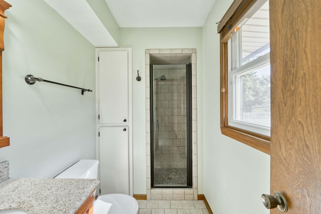 4852 S Charleston Ave, Springfield, MO 65804 - bathroom featuring a shower stall, tile patterned floors, vanity, toilet, and baseboards