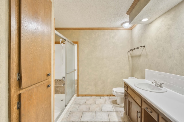 4852 S Charleston Ave, Springfield, MO 65804 - bathroom with a stall shower, ornamental molding, vanity, tile patterned flooring, and toilet