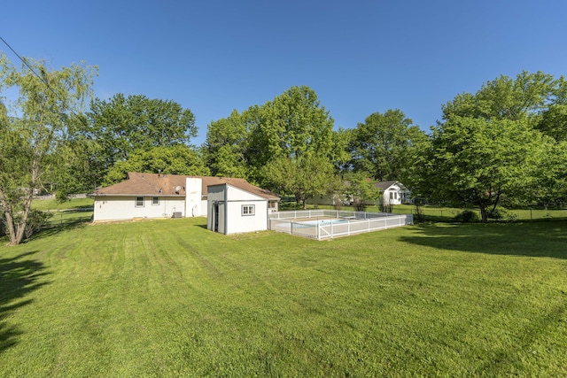 4852 S Charleston Ave, Springfield, MO 65804 - view of yard featuring a storage shed and an outbuilding