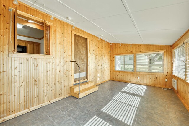 4852 S Charleston Ave, Springfield, MO 65804 - unfurnished room featuring wooden walls and baseboards