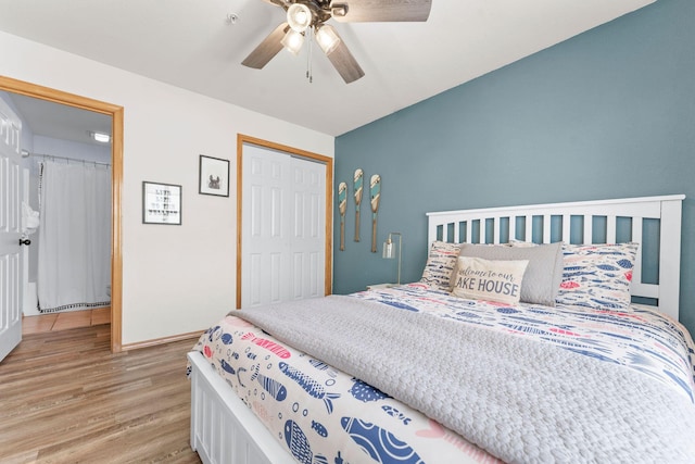 bedroom with light wood-type flooring, a closet, baseboards, and a ceiling fan