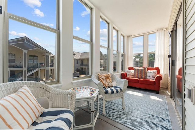 sunroom / solarium featuring carpet flooring