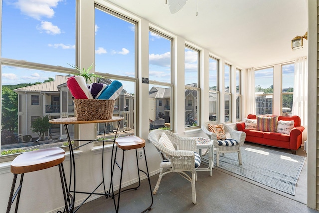 sunroom featuring floor to ceiling windows