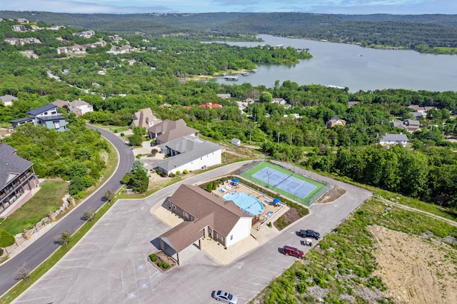 bird's eye view of a large body of water and a heavily wooded area